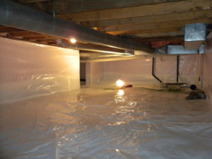 A home crawl space that has been encapsulated with a plastic barrier to prevent mold.